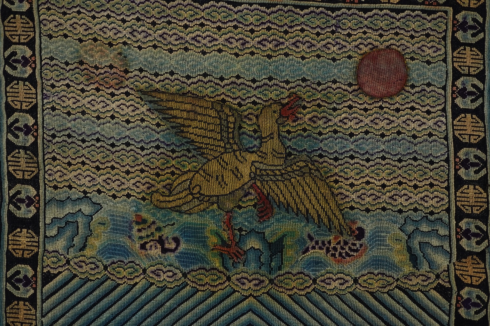 A Chinese needlepoint rank badge, 19th century